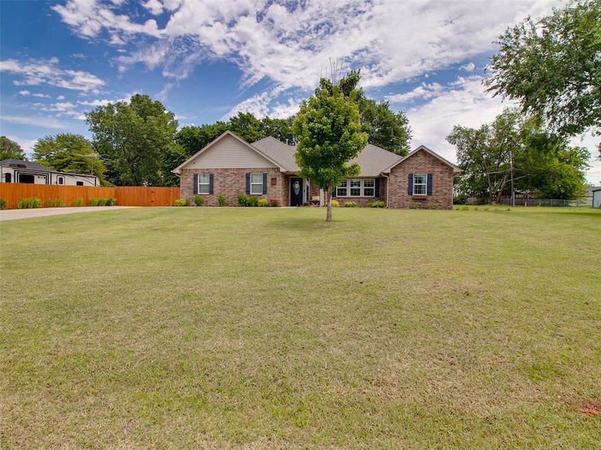 Single story home with brick siding