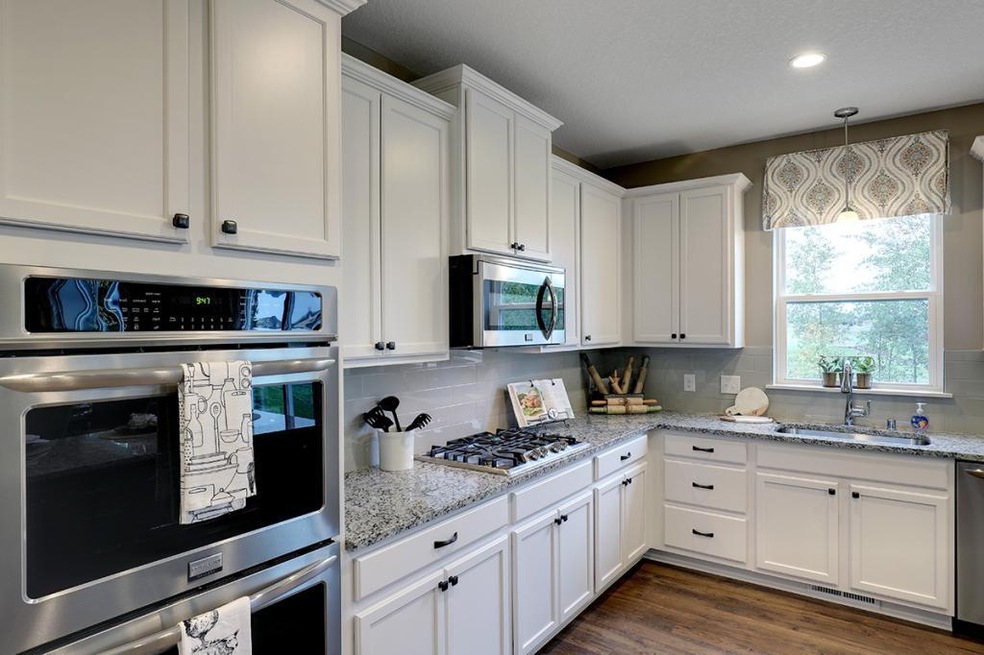 A stunning kitchen with Maple cabinets in Alpine W