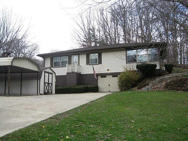 Exterior Front. One car garage plus carport & ceme