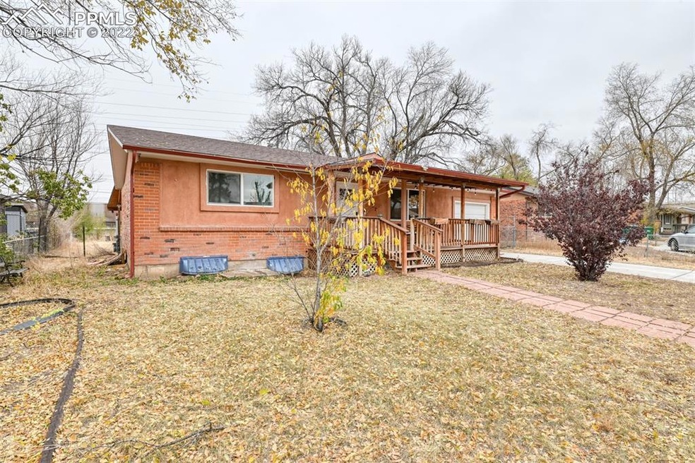 Spacious and fenced front yard with multiple trees