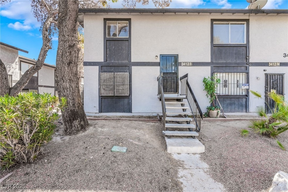 View of front of property featuring stucco siding