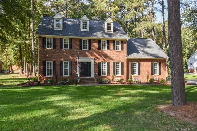 Stately home on beautiful wooded lot. Roof replace