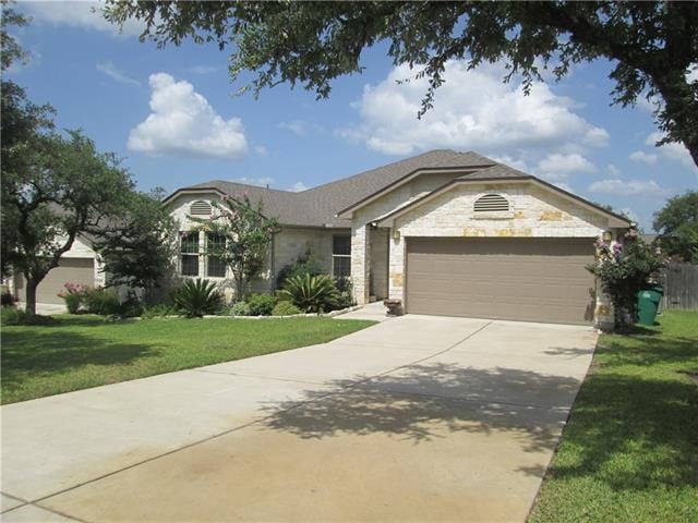 Three sides stone, beautifully landscaped, sprinkler system, trees front and side yard