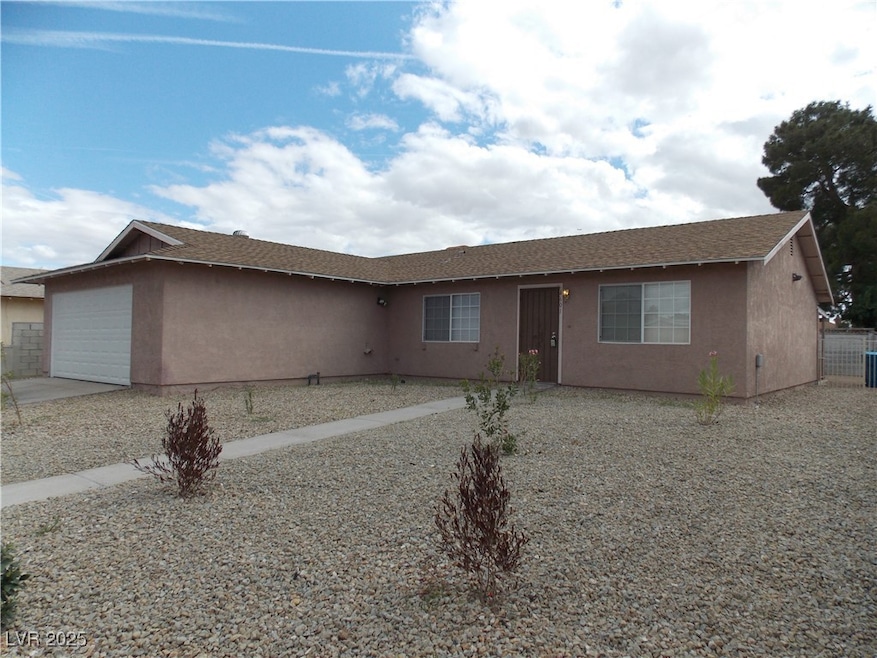 Ranch-style house with fence, concrete driveway, r