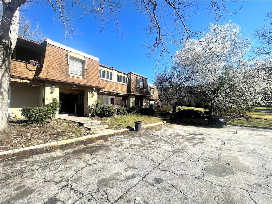 View of front of house featuring stucco siding, ro