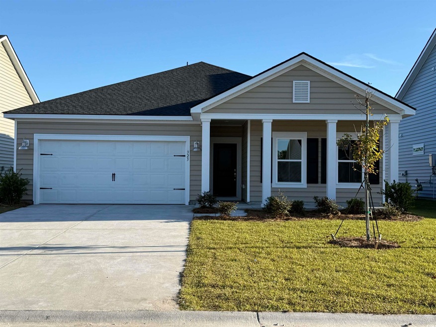 View of front of house featuring a garage and a fr