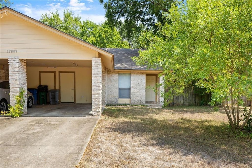View of front of house featuring driveway and a s