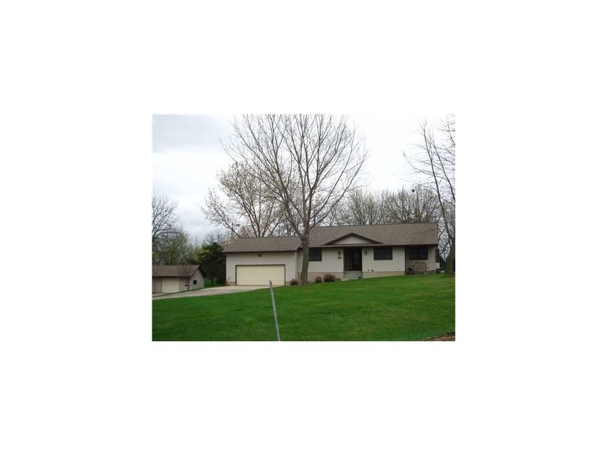 Front Exterior. In town acreage!