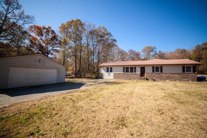 24x24 Spacious garage with shelves and windows, .76 of an acres on a large level lot, fenced in back yard and on a dead end street.