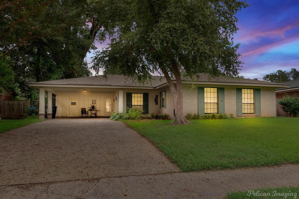 View of front of home featuring a lawn