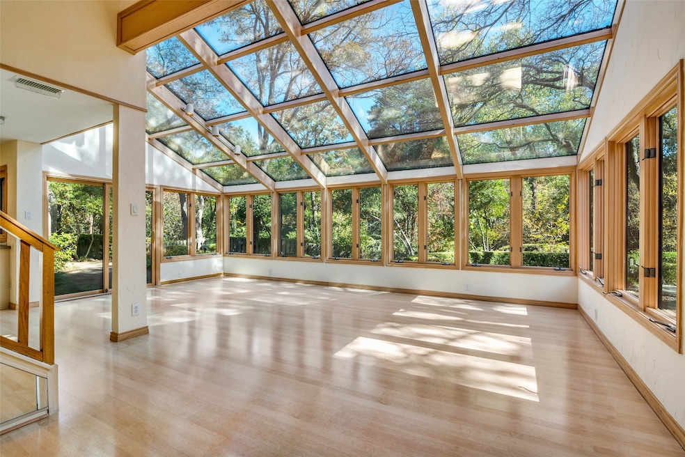 Solarium With Views of Wooded Creek Area