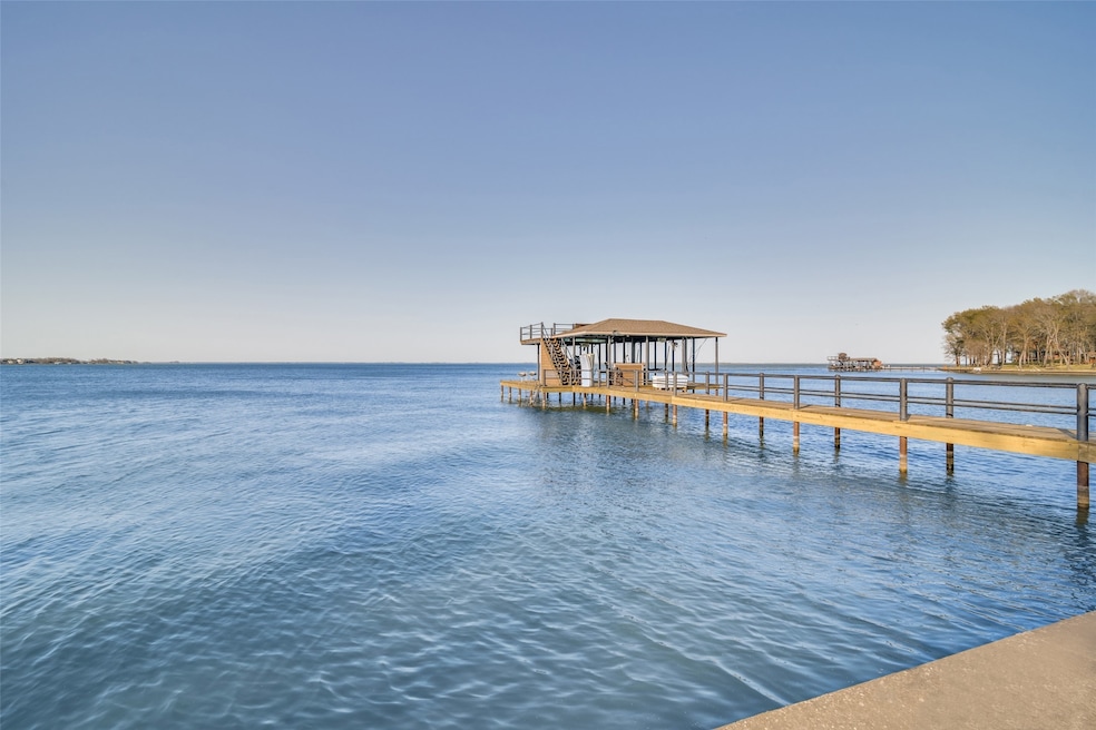 Beautiful DOC with Boat lift and 2 jet ski lifts