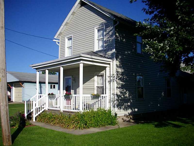 Exterior Front. ADORABLE 2 STORY WITH LARGE COVERE
