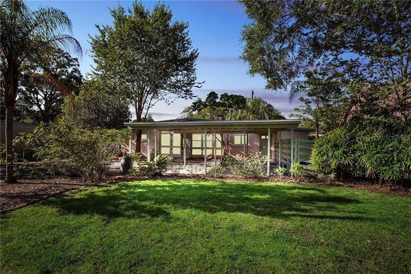Light and bright home surrounded by beautiful lush