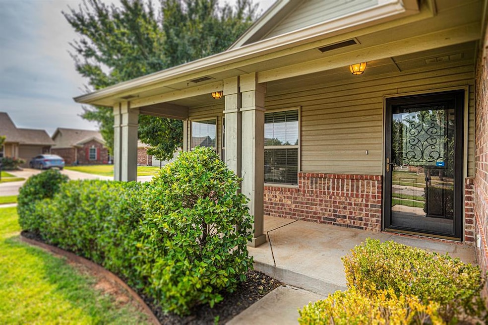 Doorway to property with brick siding and a porch