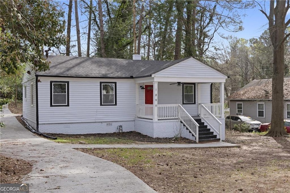 View of front of property with a porch, ceiling fan, a shingled roof, and crawl space