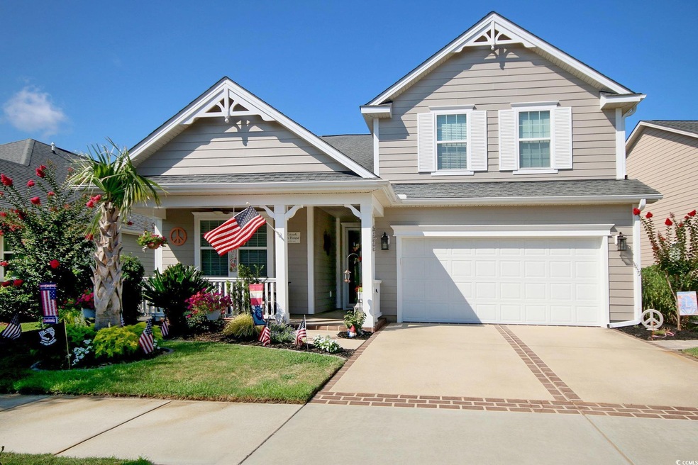 View of front of property featuring a garage