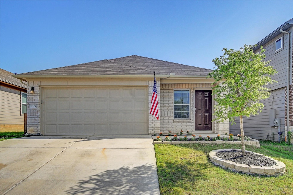 Ranch-style home featuring an attached garage, co