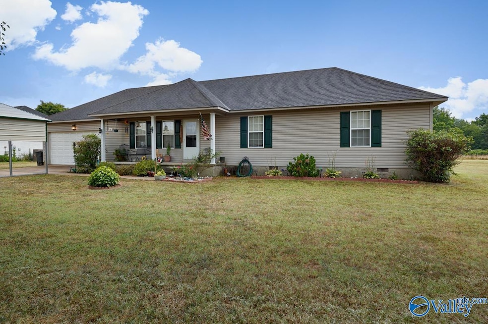 Concrete driveway & sidewalk, two car front entry garage, covered front porch, simple landscaping