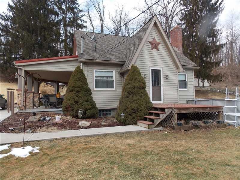 Exterior Front. Newer vinyl siding, patio, roof, f
