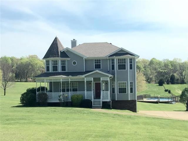 Beautiful Victorian style home with wrap around porch on 3.27 acres!!! Privacy at its best! No cramped subdivision here. Over 2 acres of property is fenced in, and an underground fence is installed around the entire property for our dog lovers.