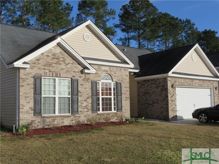 Brick front home with privacy fenced backyard