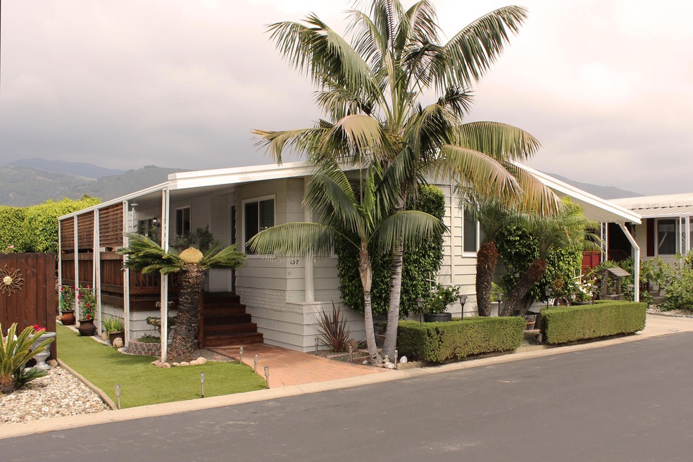Home with mountains in background