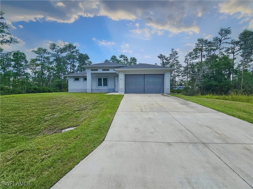 View of front of property with a front yard and a