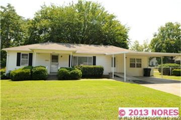 Front of home showing the large front yard and the