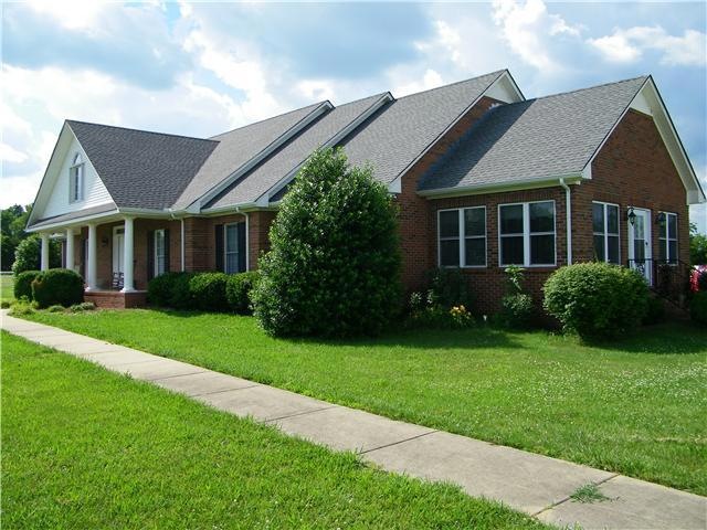 Welcome to 2920 Highway 64 W. This stately all brick home is located on 27 acres of fenced in flat fields with pond.   