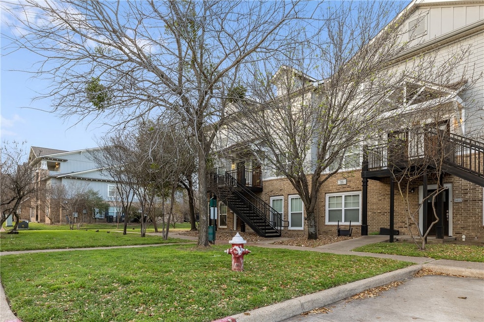 View of property's community featuring a yard and