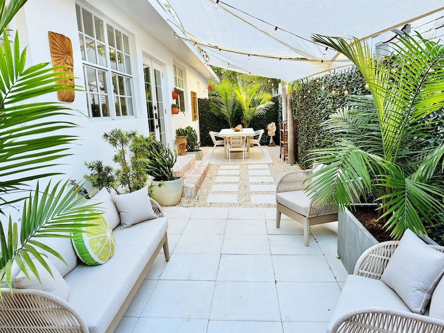 Shade sails ensconce the side patio.