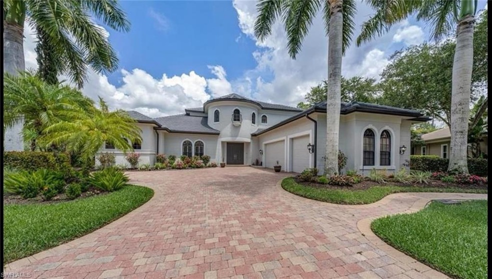 Mediterranean / spanish-style home with a garage