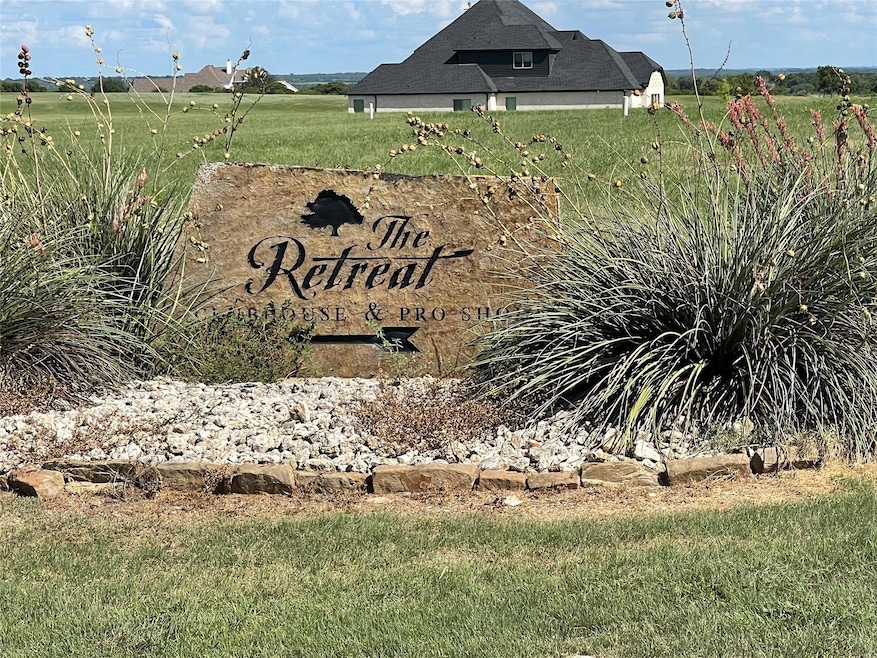 Community / neighborhood sign with a rural view
