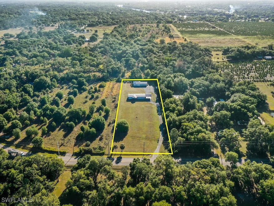 Aerial view of sparsely populated area with proper