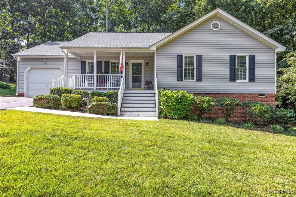 Ranch-style home featuring a porch, a garage, a fr