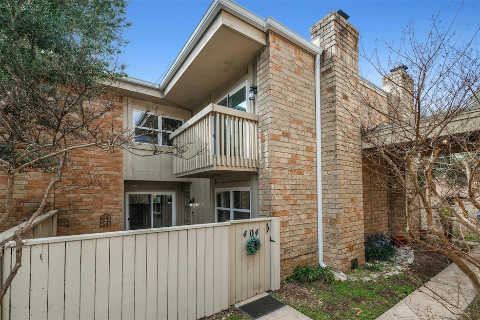 View of home's exterior featuring a balcony, a fe