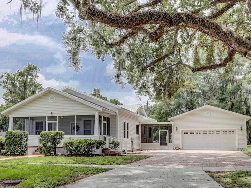 Front of the home with an attached 2 car enclosed garage.