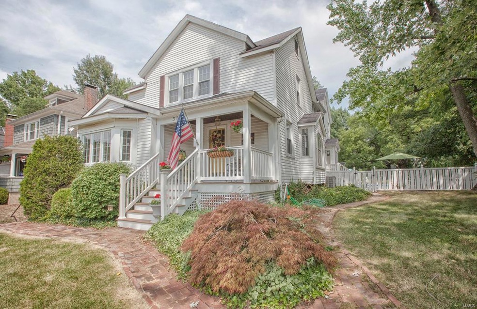 Front view 318 Summit. Brick walkway, side yard view.