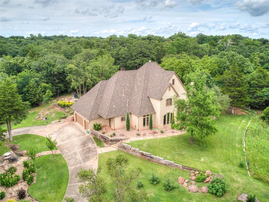 View from above of property with a heavily wooded area