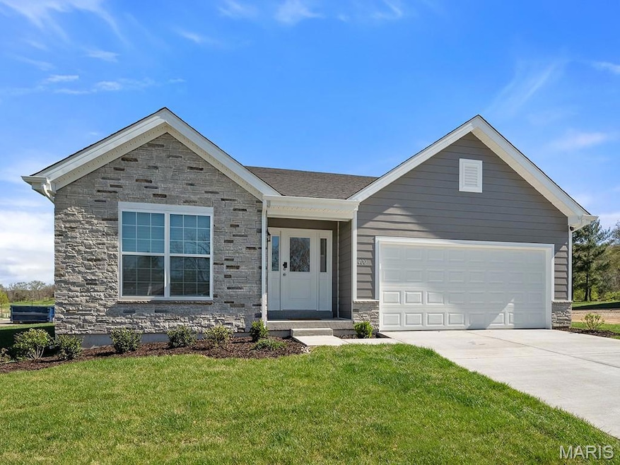Ranch-style home with stone siding, a front lawn, a garage, and concrete driveway