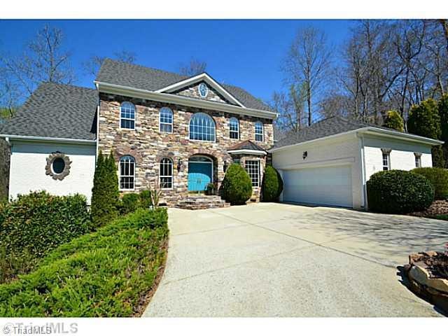 Exterior Front. Beautiful, Well Maintained Stone/Brick Home Features a Courtyard Entry Garage.  Home sits on hard to find Double Lot.