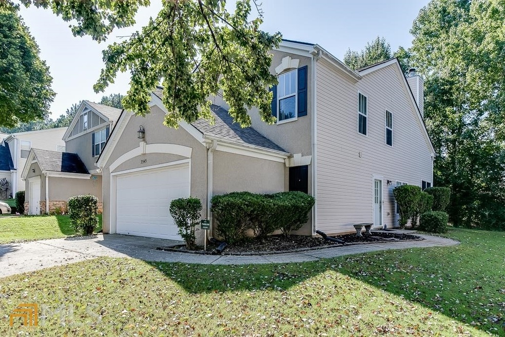 Spacious front yard and side entry door.