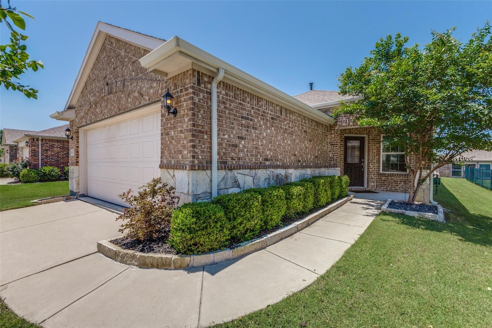 View of property exterior featuring a garage and a