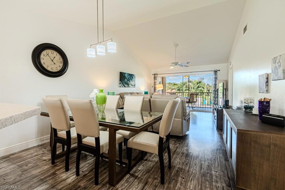 Dining area with dark hardwood / wood-style floors