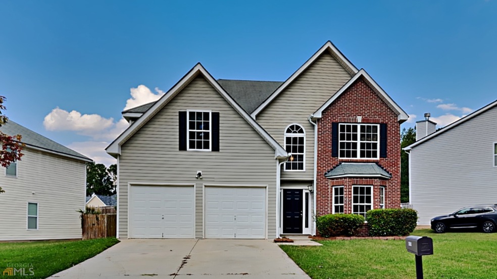 4976 Laythan Jace Ct SW, Snellville, GA 30039 - photo 1