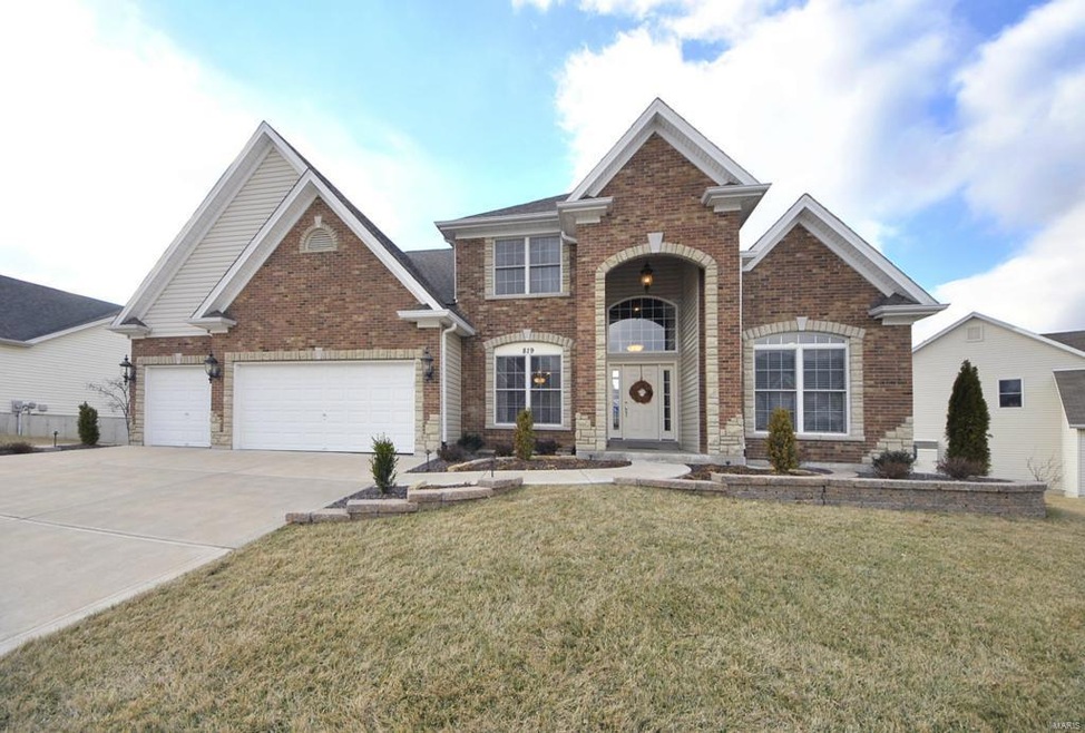 Brick and Stone Front w/ Professionally landscaped