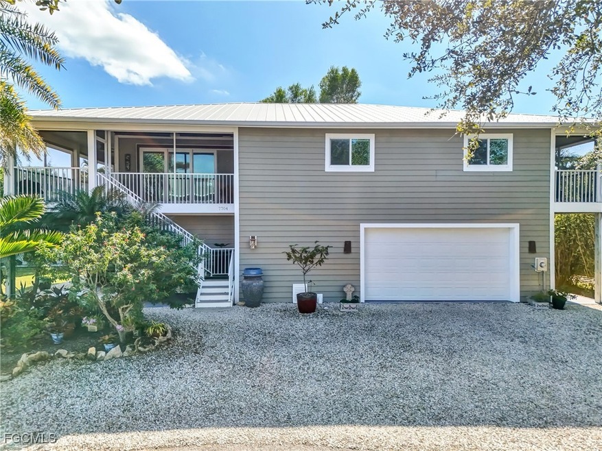 7704 Myrsine Cir unit 10, Bokeelia, FL 33922 - photo 1