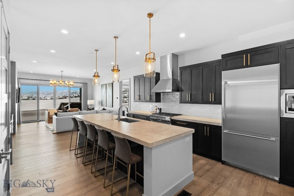 Custom kitchen looking onto living room & incredib