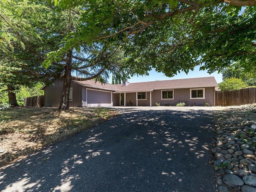 Mature trees provide shade and privacy.
